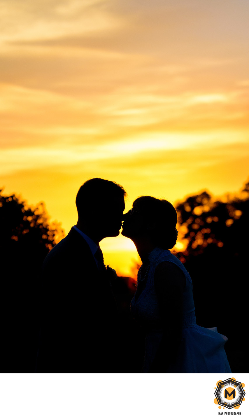 Sunset Kissing Silhouette Wedding Photograph