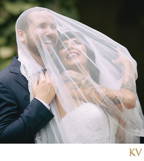 Tattooed bride & groom with veil
