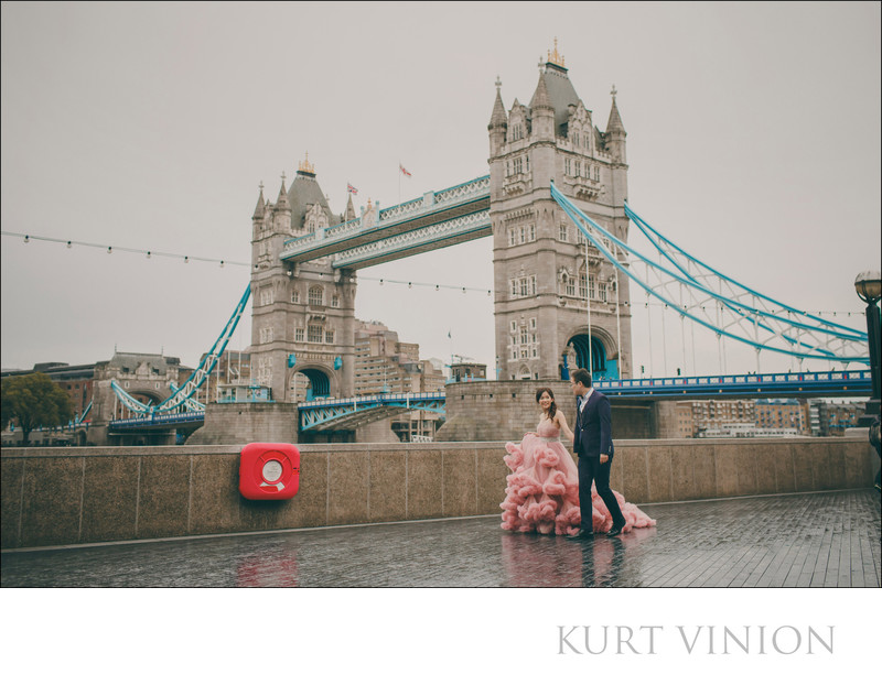 walking in the rain pink dress London Tower Bridge 