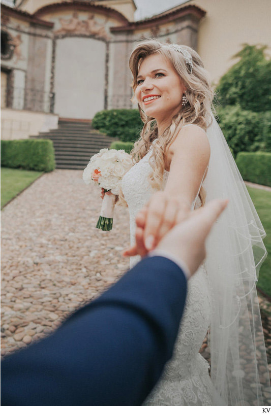 Taking the groom's hand