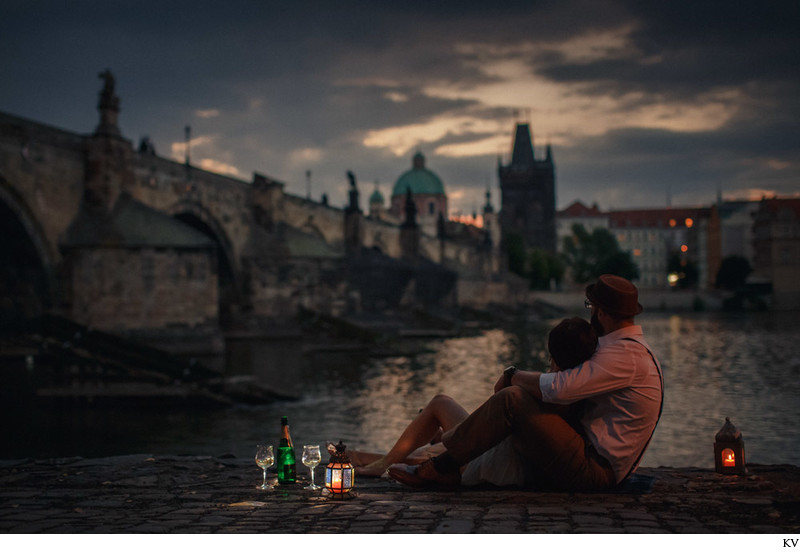 Watching sunrise over the Charles Bridge with Champagne
