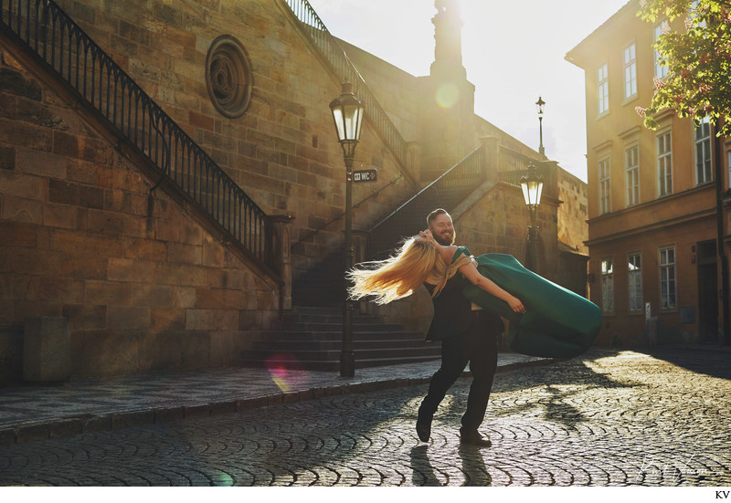 spinning his fiancee Golden Light Hour Prague portrait