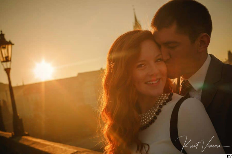 snuggling up to his beloved in Prague at sunrise 