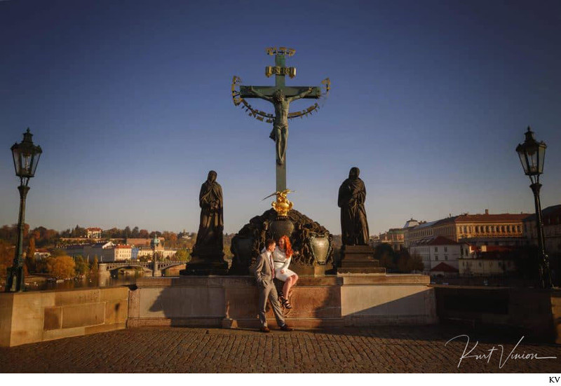 Enjoying  sun atop the Charles Bridge at sunrise