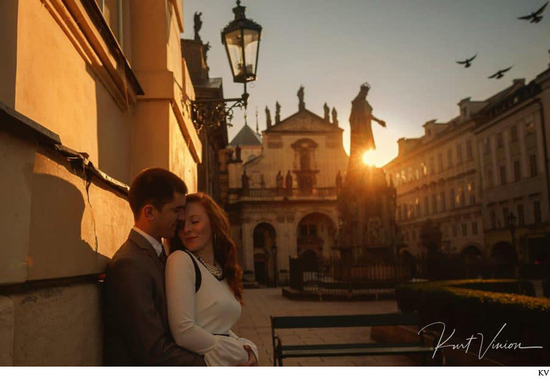 snuggling up as the summer sun rises above them Prague