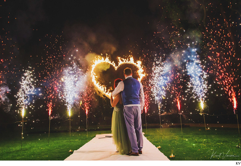 bride & groom watch a Fire Show at Chateau Mcely 