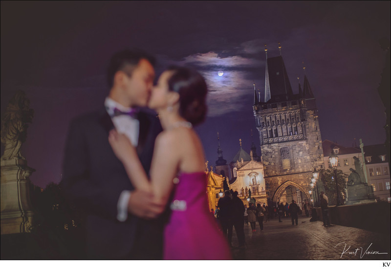 A super moon illuminates lovers on the Charles Bridge