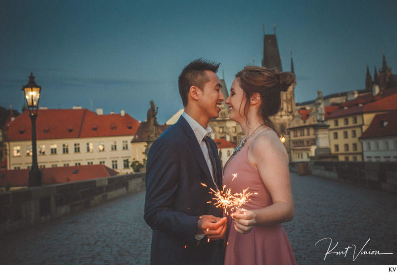 Couple with sparklers Charles Bridge twilight