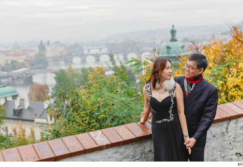 A portrait of the mom & dad overlooking Prague