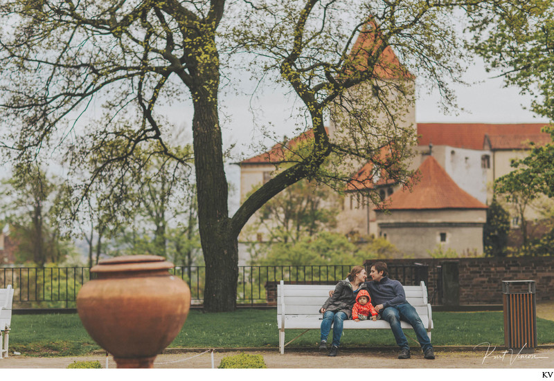 the family in the rain at Prague Castle