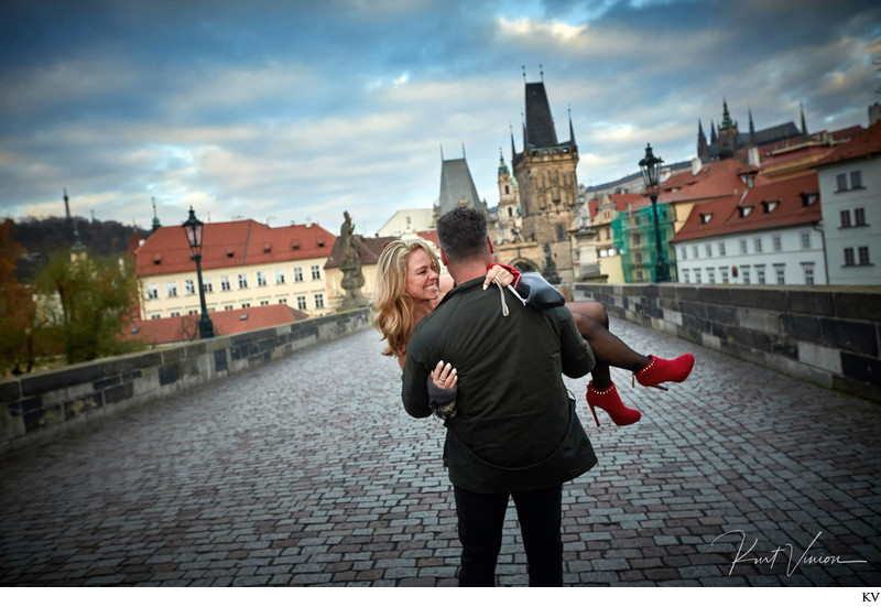 Carrying his fiancee across the Charles Bridge