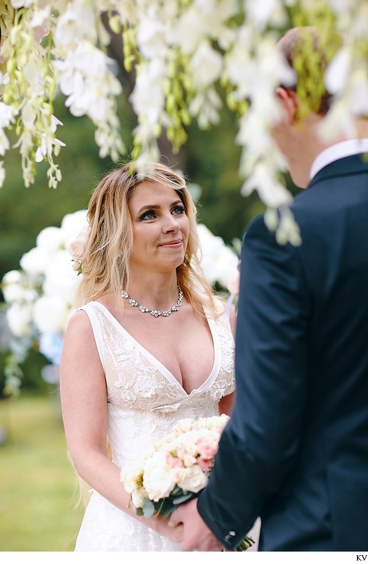 The beautiful Bride Anna listens to Sergio's vows