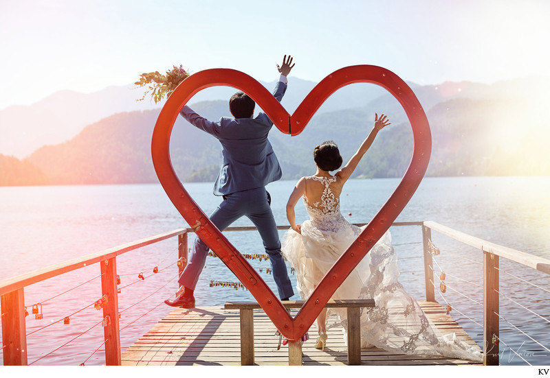 Jumping for joy with the 'Heart of Bled' wedding couple