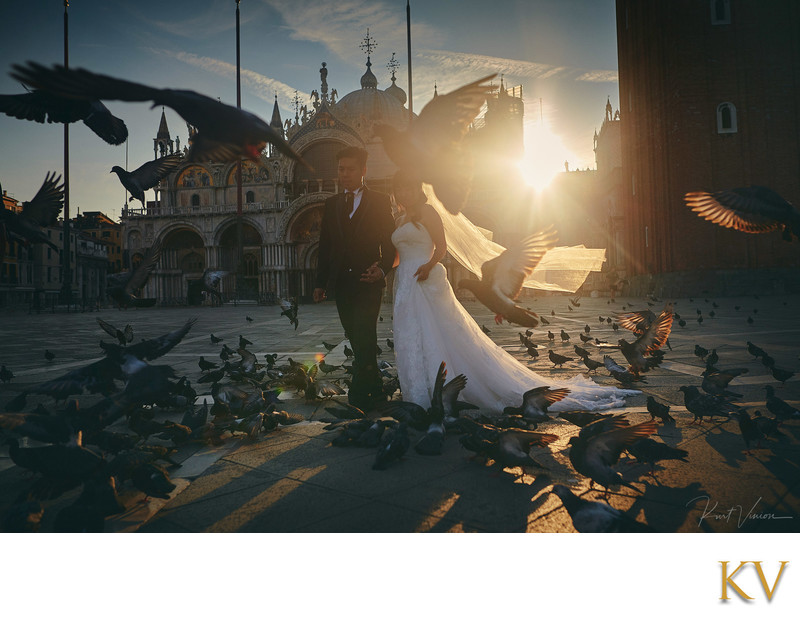 bride & groom walking in Piazza San Marco at sunrise