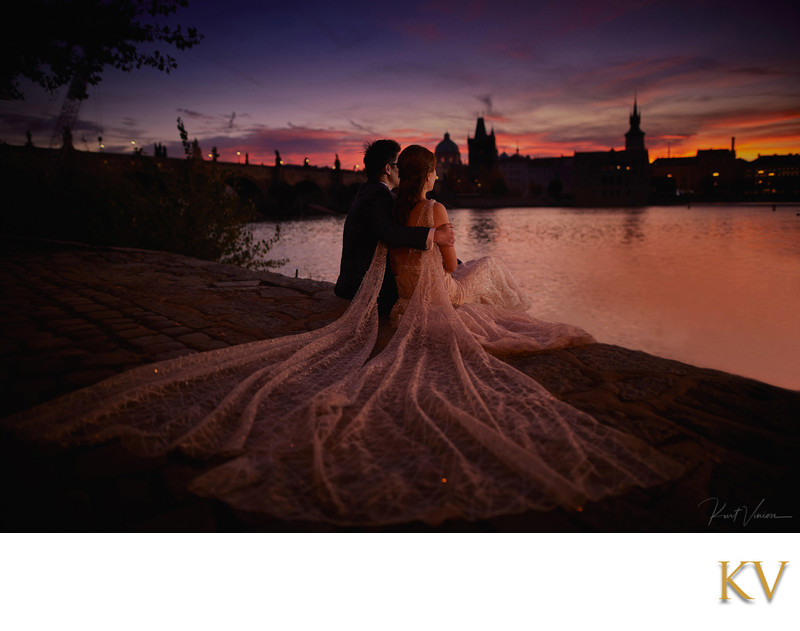 Hong Kong couple watching sunrise above Charles Bridge