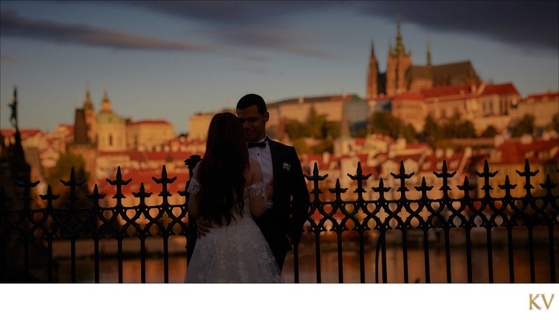 Bride & groom enjoying sunrise near Charles Bridge