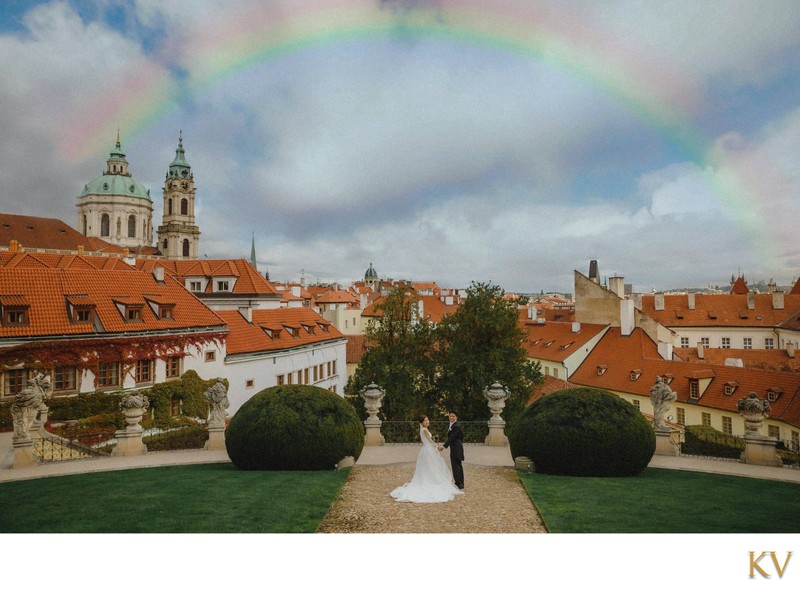 Prague Vrtba garden wedding photo rainbow above newlyweds