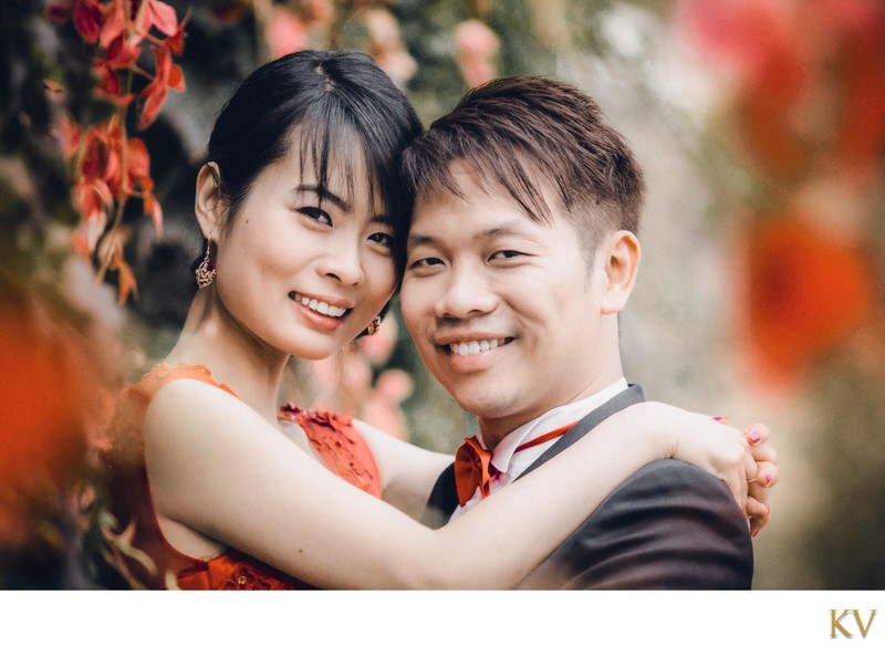 Smiling happy Chinese bride2be & her fiancee in Prague