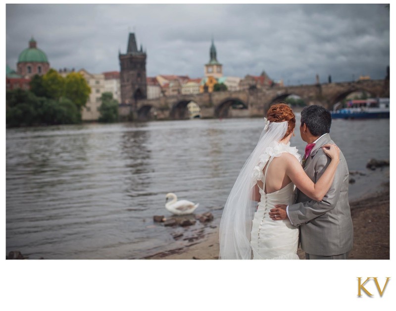 Newlyweds admiring the Prague skyline