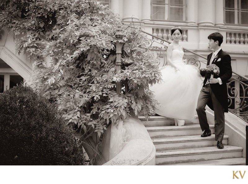 Bride escorted down stairs Palais Coburg