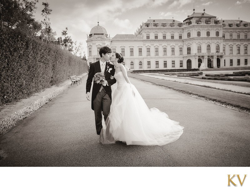 Newlyweds Kiss at the Belvedere Palace in Vienna