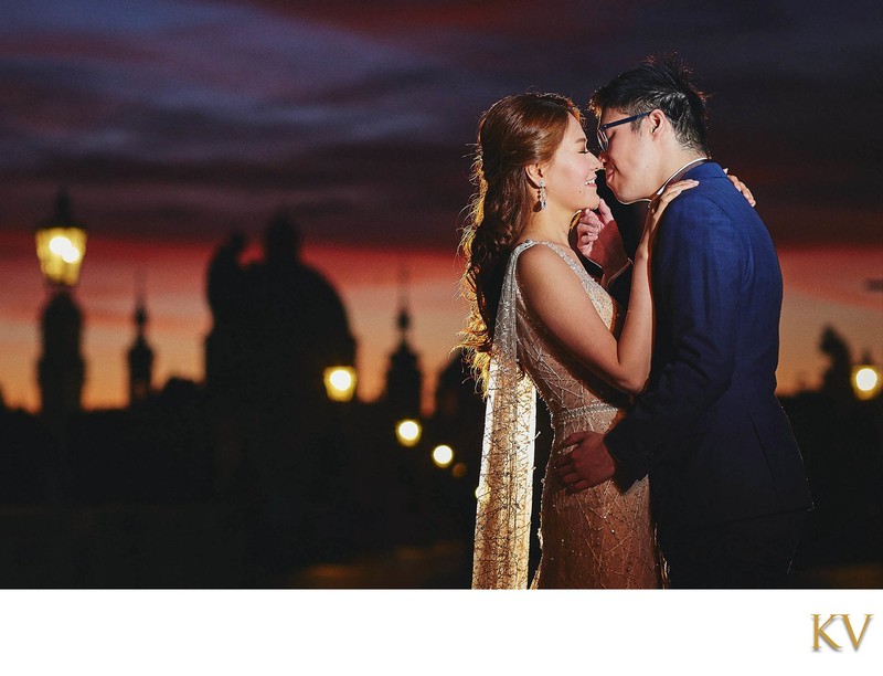 Elegant couple embracing at sunrise Charles Bridge