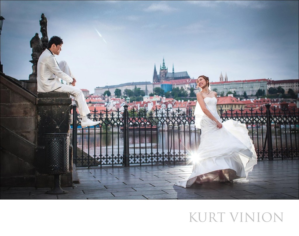 Bride twirling wedding dress near Charles Bridge