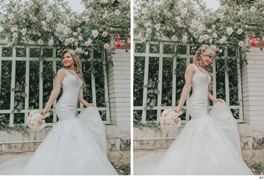 The happy bride underneath the roses