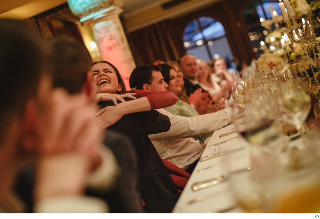 groom hugs guests