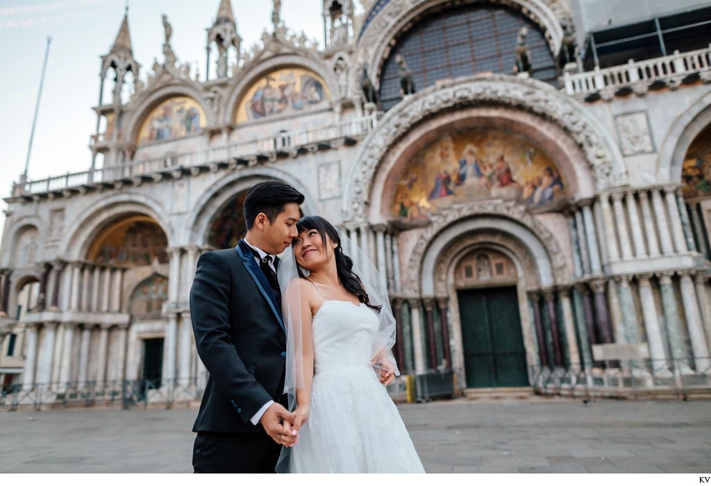 wedded couple in front of St Mark's Basilica Venice