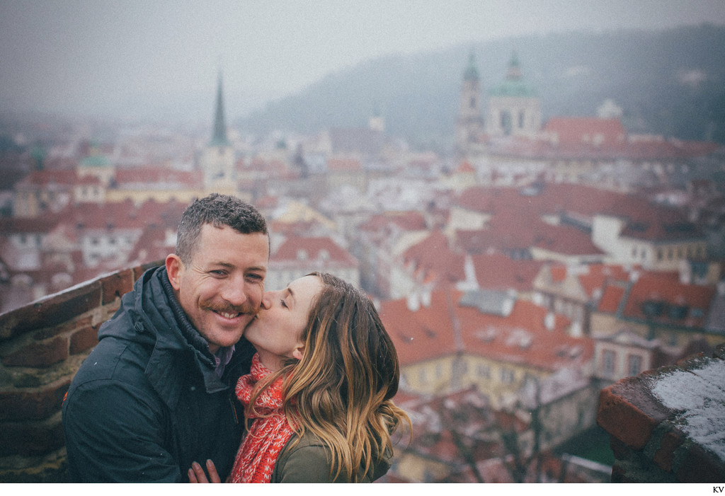A kiss for the newly engaged high above Mala Strana