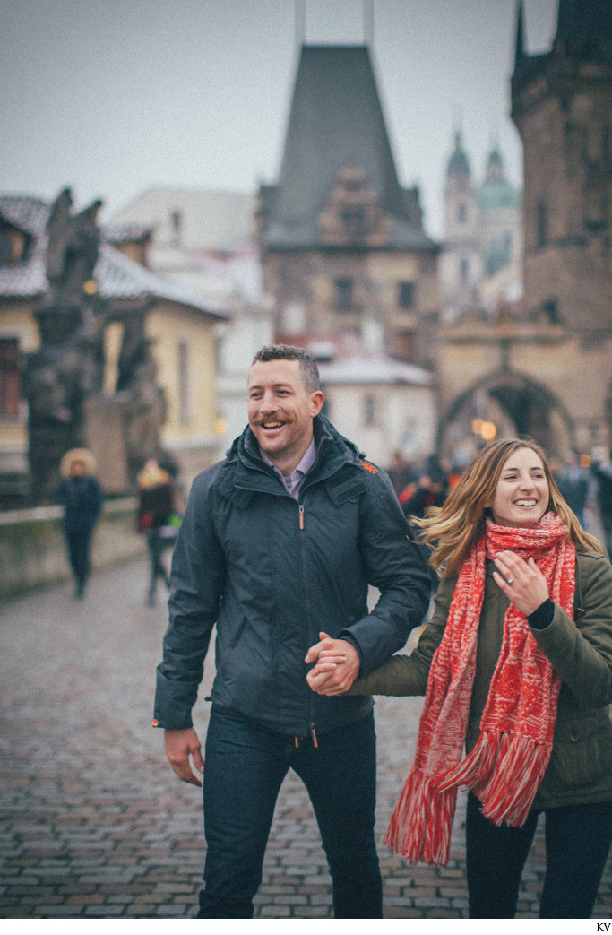 walking hand in hand across the Charles Bridge N&J 