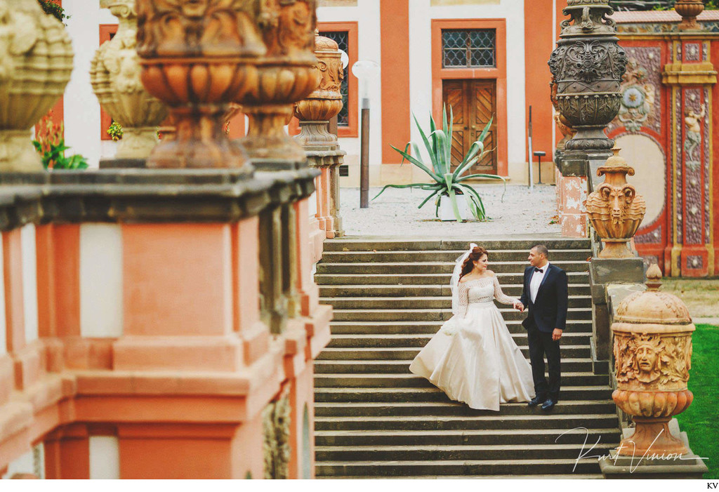 wedding couple walk around Prague Troja Chateau