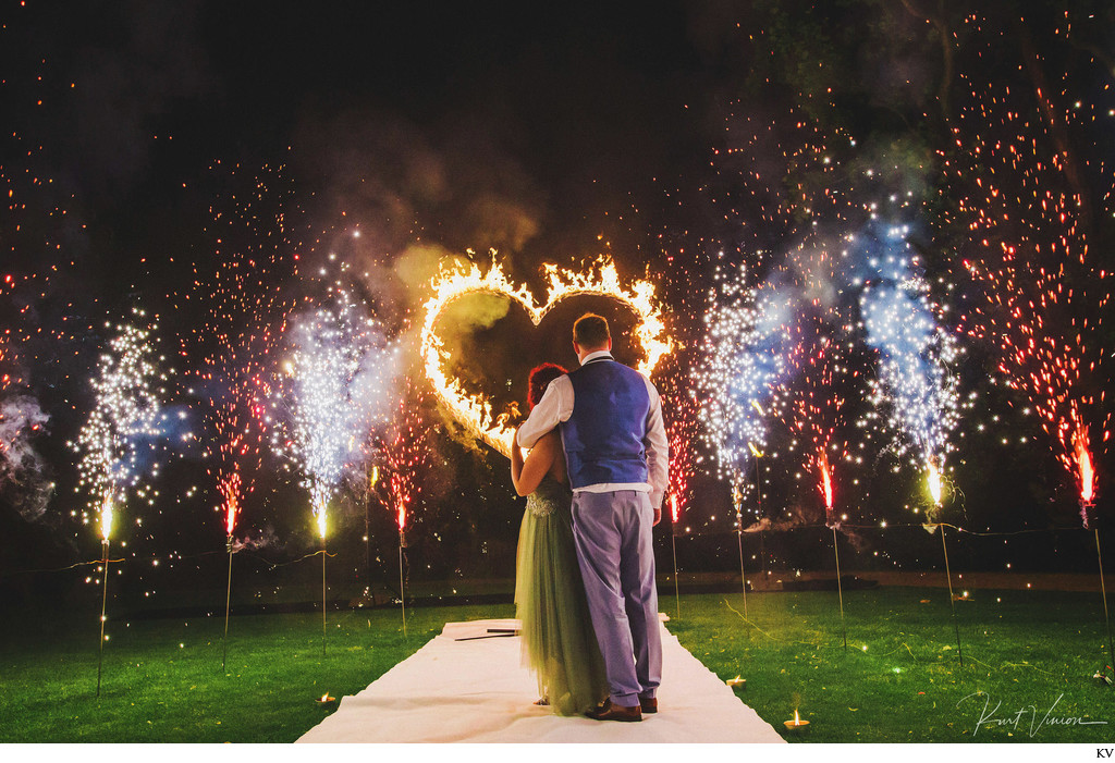 bride & groom watch a Fire Show at Chateau Mcely 