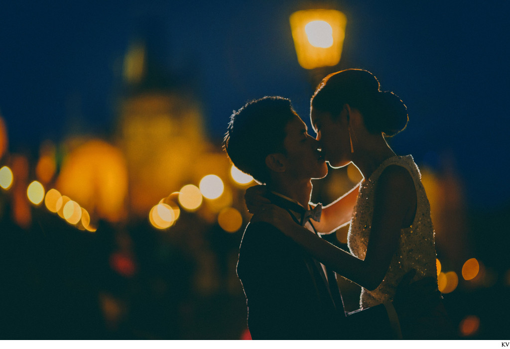 a kiss on the Charles Bridge in Prague