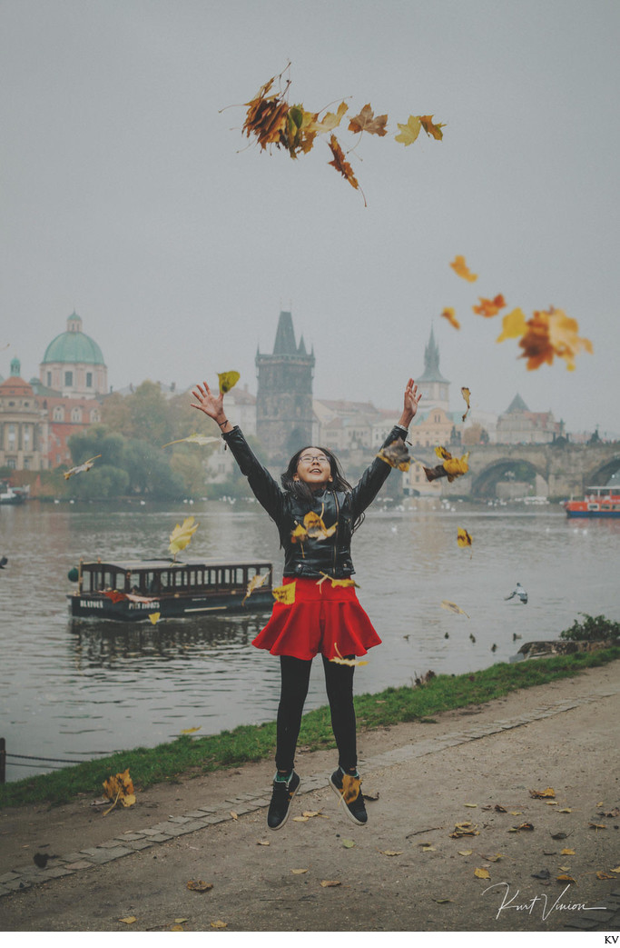 Jumping for joy with the Autumn leaves Charles Bridge