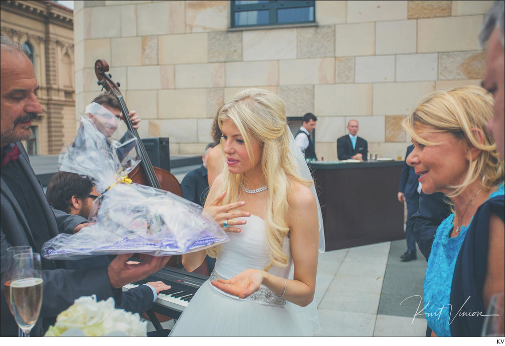 bride reacts to gifts at Four Seasons 