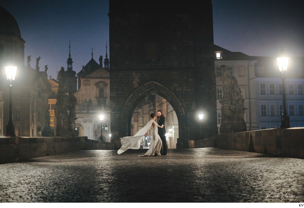 Dancing atop the Charles Bridge at night