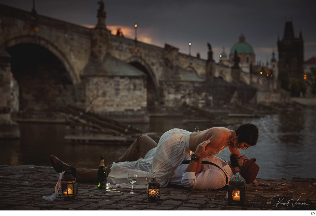 sexy Americans enjoying sunrise with champagne Charles Bridge