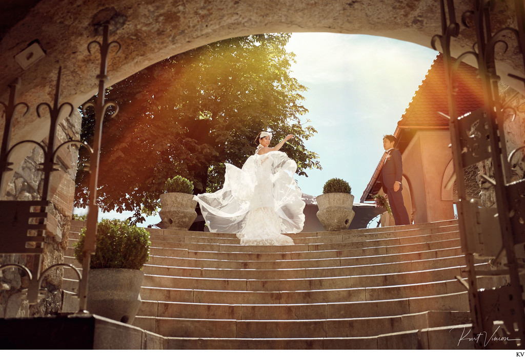 Bride fluffing her wedding dress Bled Castle Slovenia