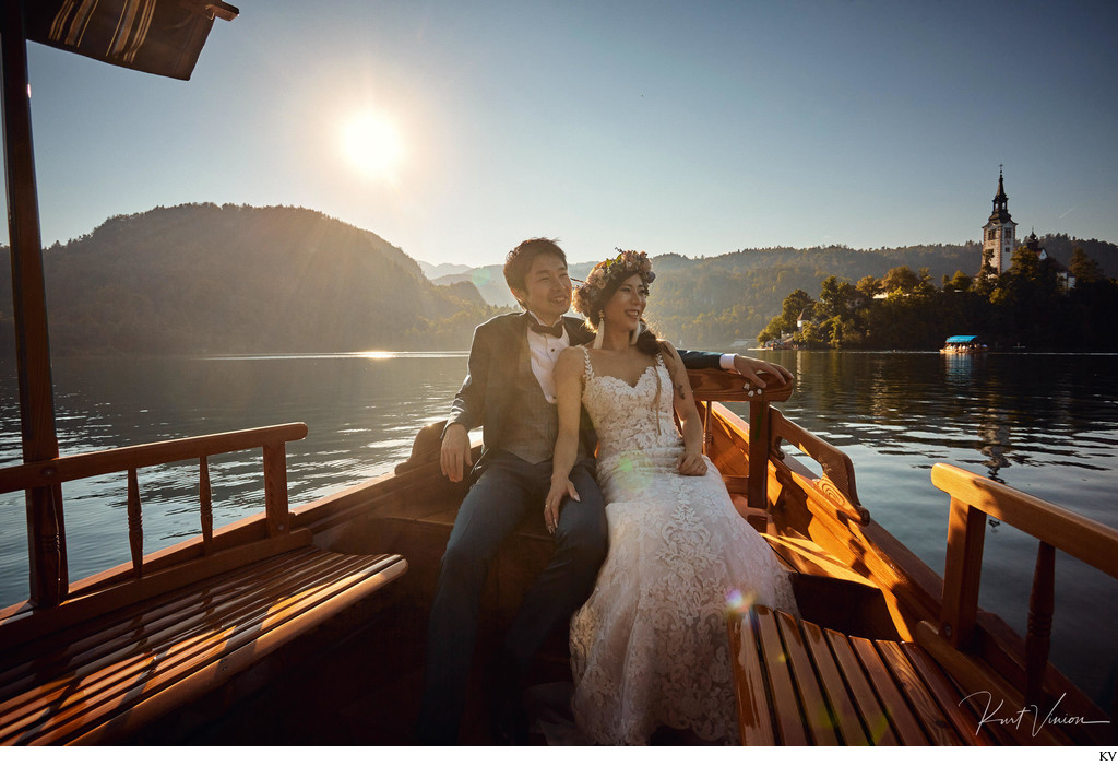 newlyweds enjoying boat ride 