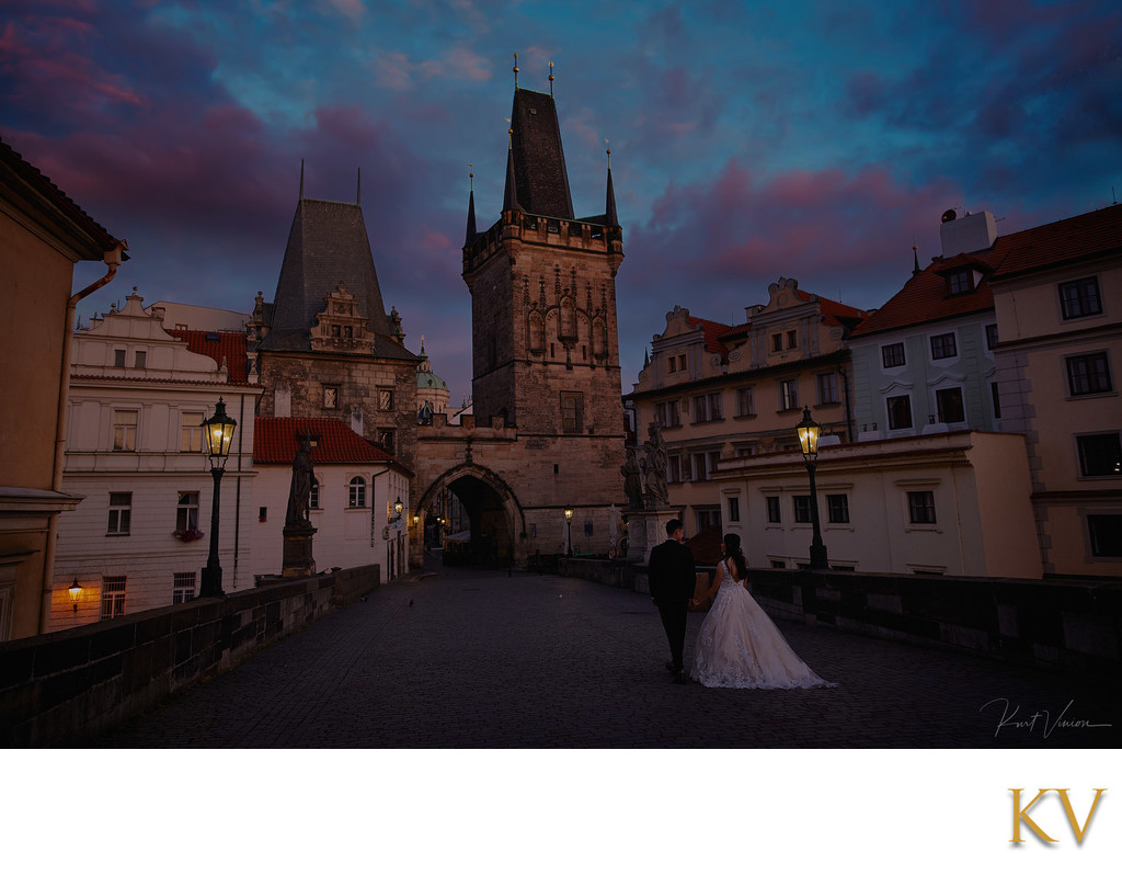 twilight lovers atop Charles Bridge