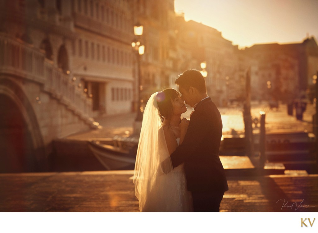wedded couple in the Golden Light in Venice at sunrise