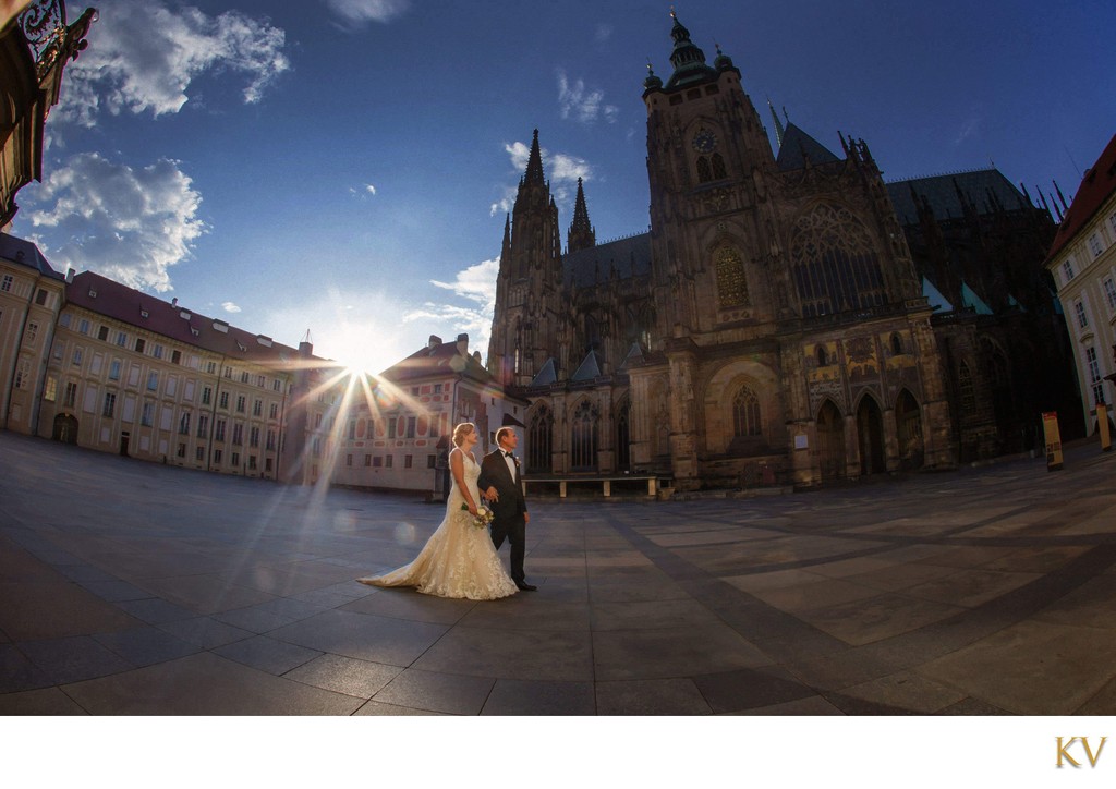 bride & groom walking near St. Vitus Cathedral