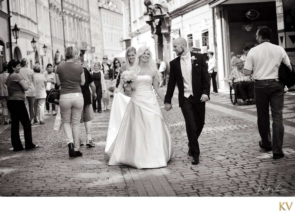 Heidi & Frank walking in Prague on wedding day
