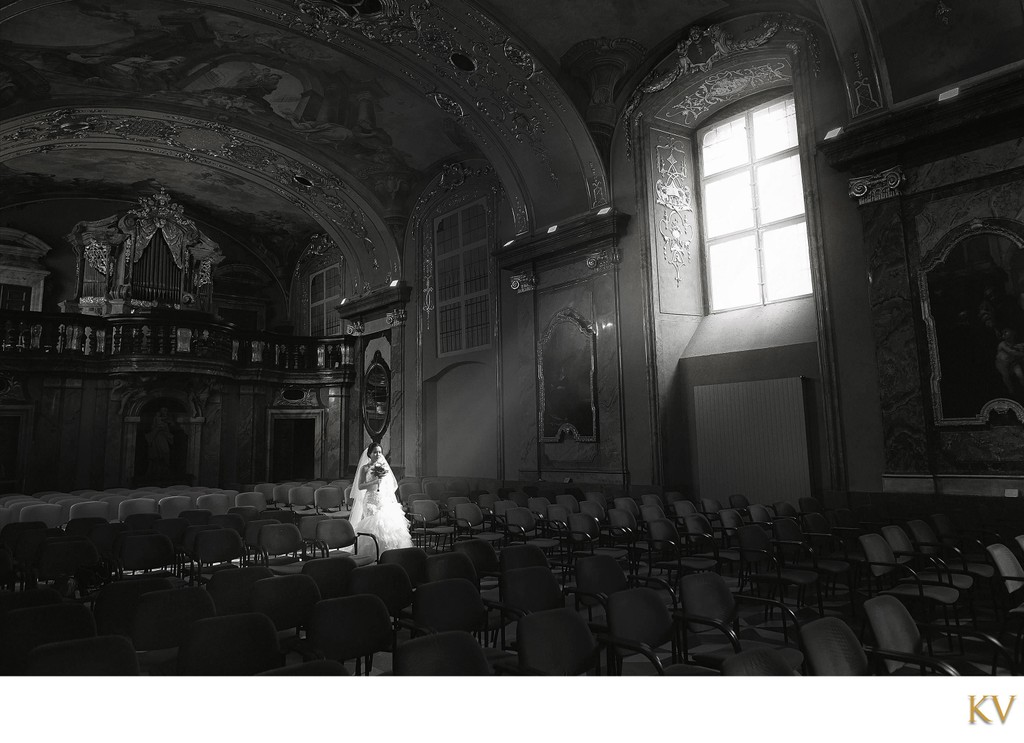 bride walking in the light at the Klementinum in Prague