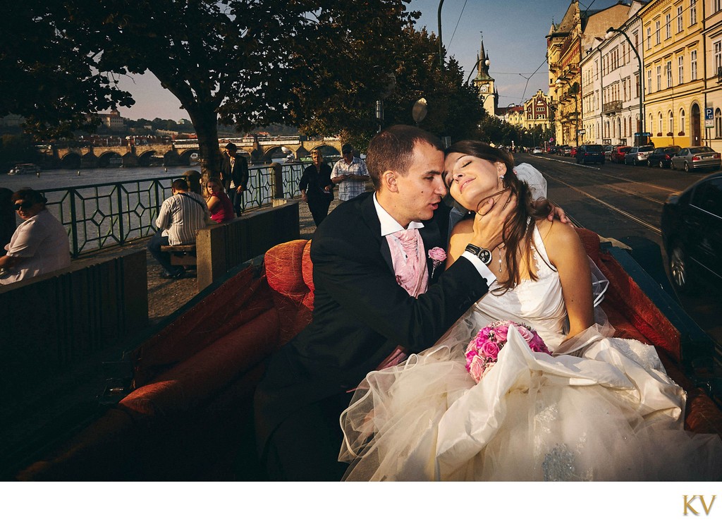 bride & groom in horse carriage in Prague