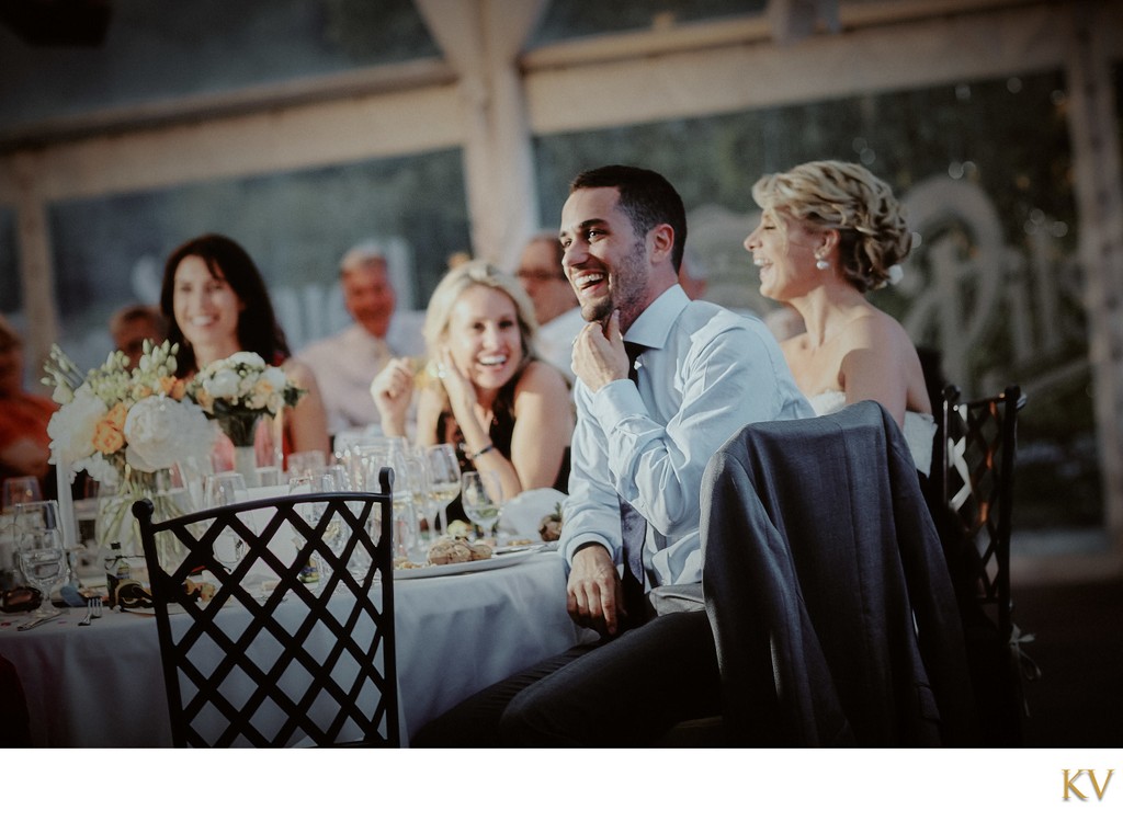 Groom listening to Best Man's speech