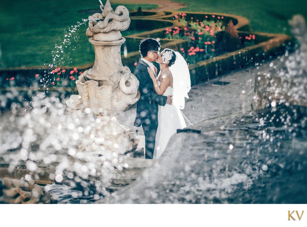 Stylish Couple kissing near the fountains in Cesky Krumlov