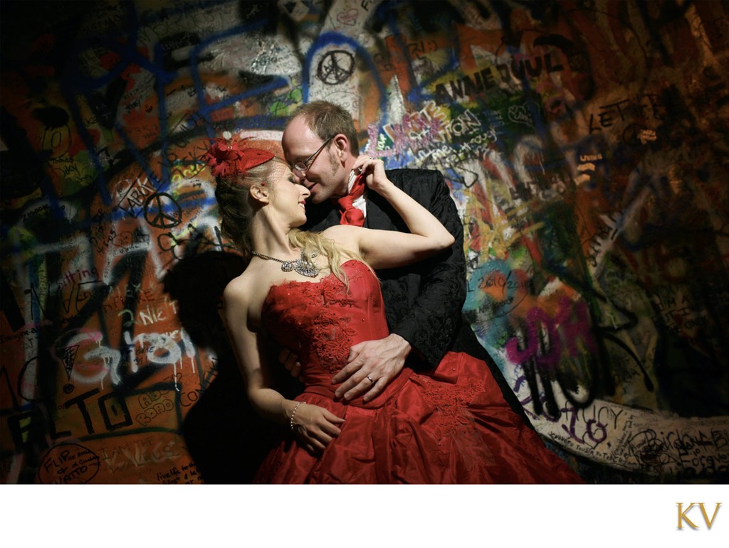 bride in red and her groom John Lennon Wall